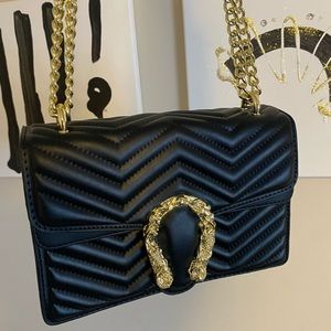 Black purse with gold hardware